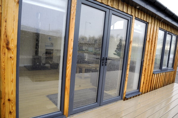 Modern French Doors on Wooden Building